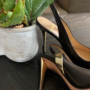 Marciano black pointy heels with gold accents
